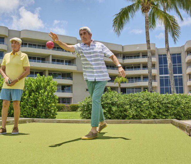 older men playing bocce ball