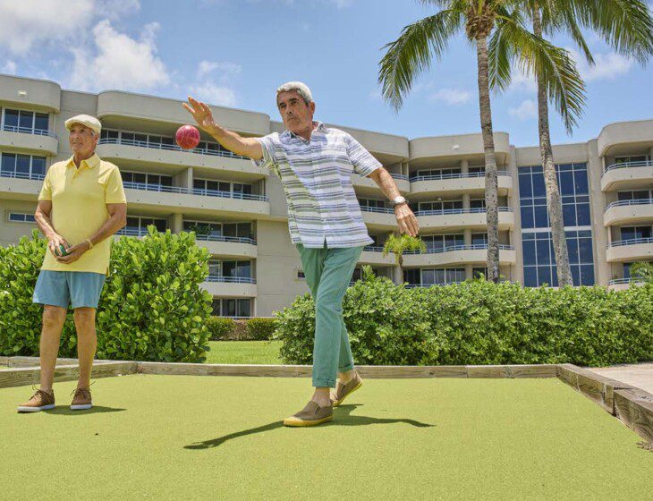 older men playing bocce ball